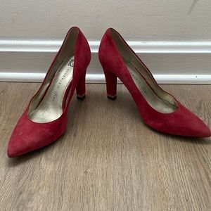 Red suede heels with gold accent on heel. Very comfortable!